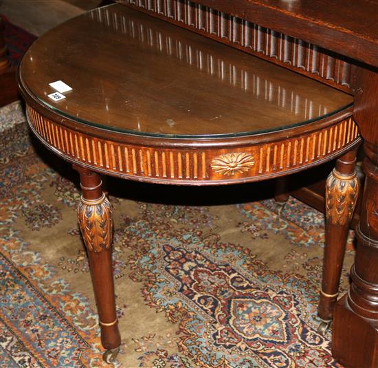 Circular side table with glass top